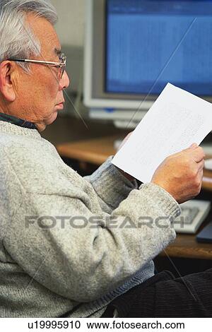 Senior adult man reading documents, Side View View Large Photo Image Stock Image - Senior adult man reading documents, Side View. Fotosearch