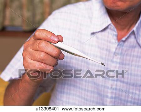 Senior adult man taking temperature, Close Up View Large Photo Image Stock Image - Senior adult man taking temperature, Close Up. Fotosearch