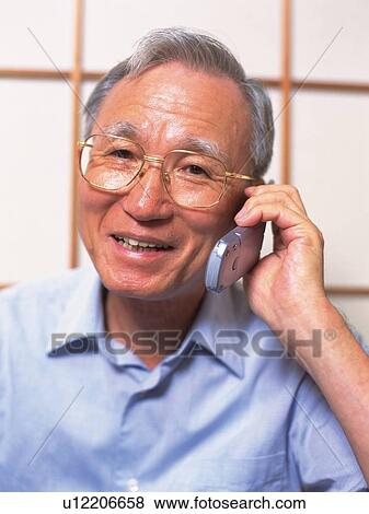 Senior adult man talking on a mobile phone, Front View View Large Photo Image Stock Photo - Senior adult man talking on a mobile phone, Front View. Fotosearch