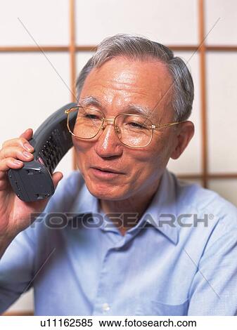 Senior adult man talking on the phone, Front View View Large Photo Image Stock Photography - Senior adult man talking on the phone, Front View. Fotosearch
