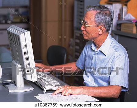 Senior adult man using a computer, Side View View Large Photo Image Stock Photo - Senior adult man using a computer, Side View. Fotosearch