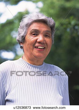 Senior adult woman smiling at camera, Front View View Large Photo Image Stock Image - Senior adult woman smiling at camera, Front View. Fotosearch