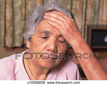 Stock Photo - Senior adult woman temperature taken, Front View. Fotosearch