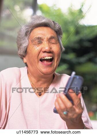 Senior adult woman using mobile phone, Front View View Large Photo Image Stock Image - Senior adult woman using mobile phone, Front View. Fotosearch