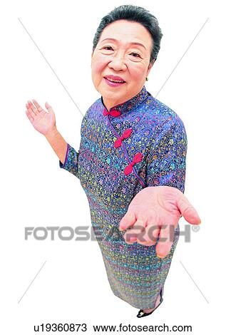 Stock Image - Gesture, Mature Adult, Standing, Smiling, White Background, Posing. Fotosearch