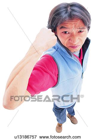 Lifestyles, White Background, Black Hair, Arm Raised, One Young Man Only, Angry View Large Photo Image Stock Photo - Lifestyles, White Background, Black Hair, Arm Raised, One Young Man Only, Angry. Fotosearch