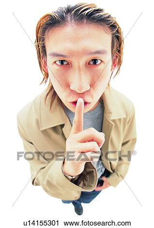Stock Image - One Young Man Only, Lifestyles, Finger On Lips, Cut Out, One Person. Fotosearch