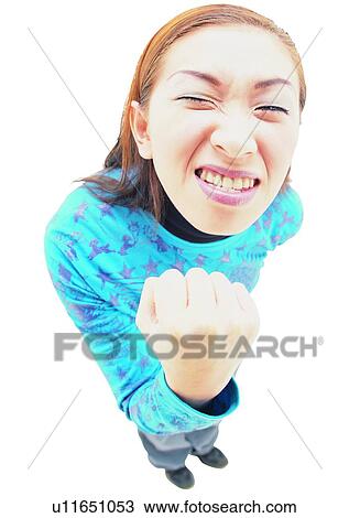 Stock Image - Young Adult, Asian Ethnicity, Posing, One Young Woman Only, Fist. Fotosearch