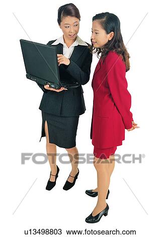 Stock Image - Brown Hair, Business Culture, Discussion, Asian Ethnicity, Talking, Technology, Adults Only. Fotosearch