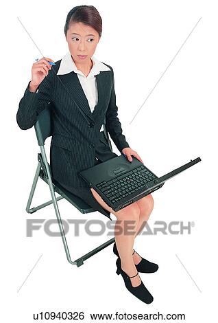 Business Suit, Chair, Brown Hair, Asian, Asian Ethnicity, Wireless Technology View Large Photo Image Stock Photograph - Business Suit, Chair, Brown Hair, Asian, Asian Ethnicity, Wireless Technology. Fotosearch