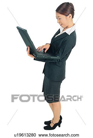 Stock Image - Clipping Path, Brown Hair, Efficiency, Businesswoman, One Person, Standing. Fotosearch
