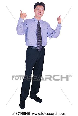 Stock Photograph - Lifestyles, Work, Businessman, Standing, Looking At Camera, Indoor. Fotosearch