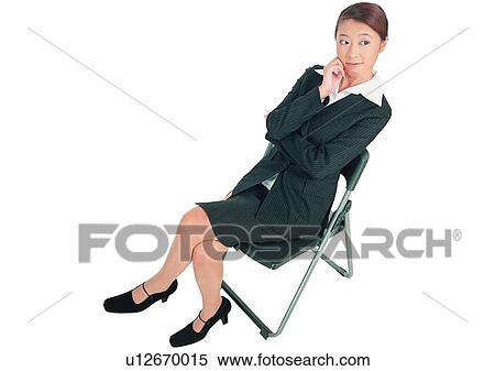 Stock Photography - Pen, Contemplation, Asian Ethnicity, Business Suit, Sitting. Fotosearch