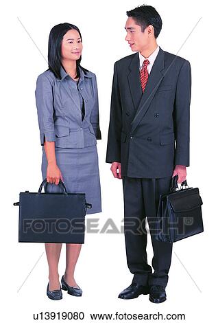 Stock Image - Talking, Adults Only, Formal Clothing, Clipping Path, Looking At Each Other, Cut Out, Business Culture. Fotosearch