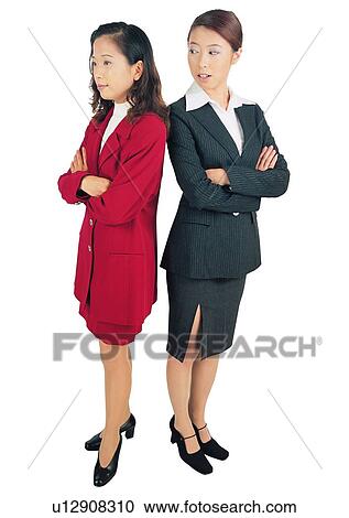 Stock Image - White Background, Indoor, Asian Ethnicity, Brown Hair, Businesswomen. Fotosearch