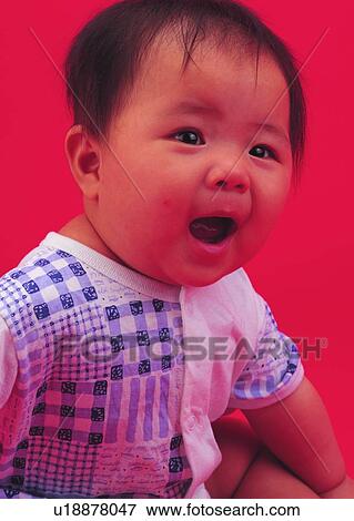 Stock Photo - child, baby, cute, sitting, toddler, Asian. Fotosearch