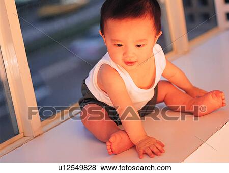 Stock Photo - child, sitting, kid, baby, cute, lovely. Fotosearch