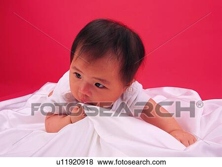 Stock Photo - kid, Asian, toddler, lovely, sitting. Fotosearch