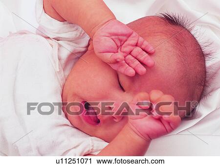 Stock Image - kid, lovely, sleeping, blanket, toddler. Fotosearch