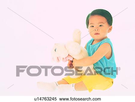Stock Photography - kid, lovely, stuffed, Asian, toddler, cute. Fotosearch