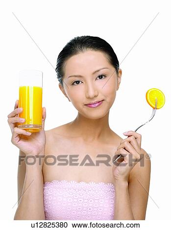 Stock Image - Beauty And Fruits, Beauty & Fruits, Beauty, Black Hair, Citrus Fruit, Close-Up. Fotosearch