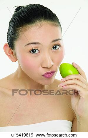 Stock Photo - Beauty And Fruits, Beauty & Fruits, Beauty, Black Hair, Citrus Fruit, Close-Up. Fotosearch