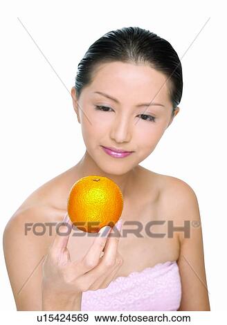 Stock Photo - Beauty And Fruits, Beauty & Fruits, Beauty, Black Hair, Close-Up. Fotosearch