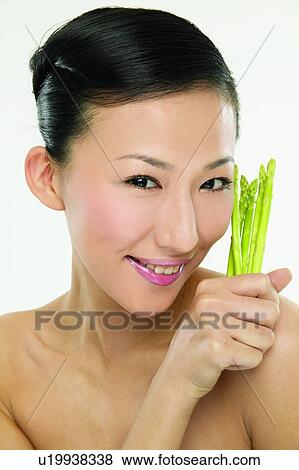 Stock Photo - Beauty And Fruits, Beauty & Fruits, Beauty, Black Hair, Close-Up. Fotosearch