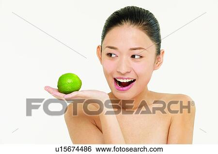 Beauty And Fruits, Beauty & Fruits, Beauty, Black Hair, Citrus Fruit, Close-Up View Large Photo Image Stock Photograph - Beauty And Fruits, Beauty & Fruits, Beauty, Black Hair, Citrus Fruit, Close-Up. Fotosearch