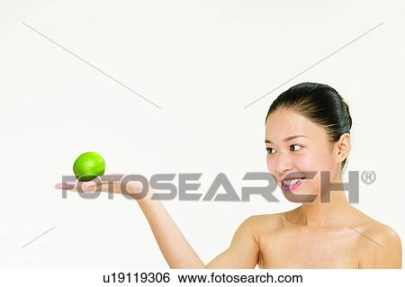 Beauty And Fruits, Beauty & Fruits, Beauty, Black Hair, Citrus Fruit, Close-Up View Large Photo Image Stock Photograph - Beauty And Fruits, Beauty & Fruits, Beauty, Black Hair, Citrus Fruit, Close-Up. Fotosearch