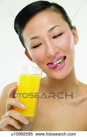 Stock Photography - Beauty And Fruits, Beauty & Fruits, Beauty, Black Hair, Close-Up. Fotosearch