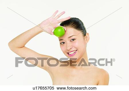 Stock Photography - Beauty And Fruits, Showing, Head And Shoulders, One Person, Gesturing, Smiling, Food And Drink. Fotosearch