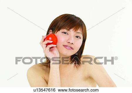 Stock Photograph - Beauty & Fruits, Healthy Eating, Medium-Length Hair, Holding. Fotosearch