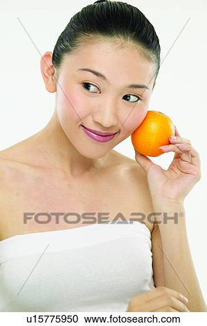 Stock Image - Beauty & Fruits, Holding, Hair Back, Beauty And Fruits. Fotosearch