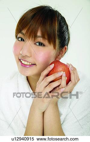 Brown Hair, Bangs, Beauty, Beauty & Fruits, Beauty And Fruits, Apple View Large Photo Image Stock Photography - Brown Hair, Bangs, Beauty, Beauty & Fruits, Beauty And Fruits, Apple. Fotosearch