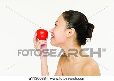 Picture - Close-Up, Beauty And Fruits, Black Hair, Beauty, Beauty & Fruits, Apple. Fotosearch