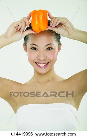 Stock Photograph - Close-Up, Beauty And Fruits, Black Hair, Beauty, Beauty & Fruits, Arm Outstretched. Fotosearch
