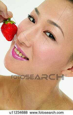 Eastern, Healthy Eating, Toothy Smile, Beauty And Fruits, Head And Shoulders, Young Adult View Large Photo Image Stock Photo - Eastern, Healthy Eating, Toothy Smile, Beauty And Fruits, Head And Shoulders, Young Adult. Fotosearch