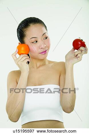 Looking Sideways, Vegetable, Holding, Beauty, Healthy Eating View Large Photo Image Stock Photo - Looking Sideways, Vegetable, Holding, Beauty, Healthy Eating. Fotosearch
