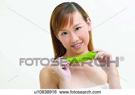 Stock Photograph - White Background, Toothy Smile, Happiness, Indoor, Healthy Eating. Fotosearch