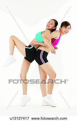 Stock Photo - Beauty, Adults Only, Back To Back, Asian Ethnicity, Arm In Arm, 18-19 Years. Fotosearch