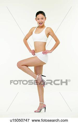 Beauty, Young Adult, Posing, High Heels, Sports Clothing, 18-19 Years View Large Photo Image Stock Photo - Beauty, Young Adult, Posing, High Heels, Sports Clothing, 18-19 Years. Fotosearch