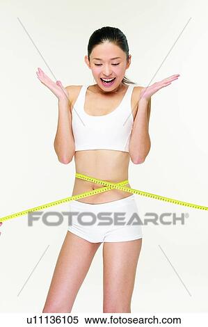 Black Hair, Sports, Standing, Beauty, Measuring Tape, Dieting View Large Photo Image Stock Photography - Black Hair, Sports, Standing, Beauty, Measuring Tape, Dieting. Fotosearch