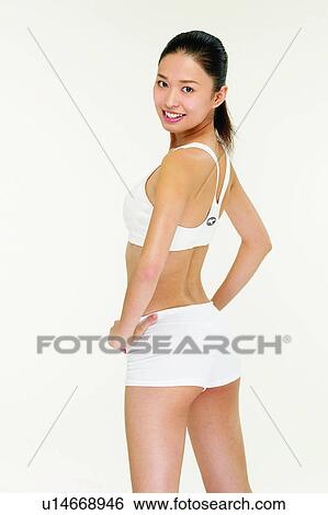 Indoor, Black Hair, Standing, 18-19 Years, Looking At Camera, Sports Clothing, Sports Bra View Large Photo Image Stock Photograph - Indoor, Black Hair, Standing, 18-19 Years, Looking At Camera, Sports Clothing, Sports Bra. Fotosearch
