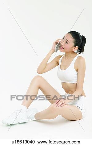 Stock Image - Looking Up, Indoor, Shorts, Sitting, Mobility. Fotosearch
