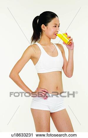 Stock Image - One Person, Food And Drink, Looking Away, Glass, Freshness, 18-19 Years. Fotosearch