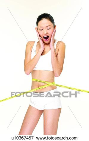 One Person, Self Improvement, Shorts, Beauty Sports, Measuring Tape, Indoor, Sports Bra View Large Photo Image Stock Photo - One Person, Self Improvement, Shorts, Beauty Sports, Measuring Tape, Indoor, Sports Bra. Fotosearch