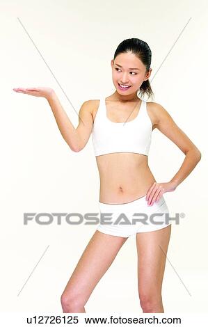 Shorts, Looking Away, Content, Cheerful, Toothy Smile, Hand On Hip View Large Photo Image Stock Photography - Shorts, Looking Away, Content, Cheerful, Toothy Smile, Hand On Hip. Fotosearch