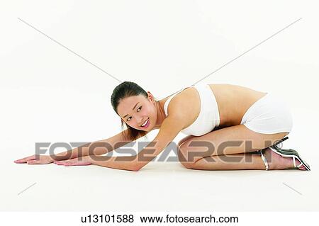 Stock Photo - Smiling, Sports Bra, Leaning, 18-19 Years, Sports Clothing, Lifestyles. Fotosearch