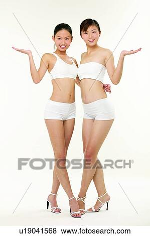 Stock Photo - Sports Bra, High Heels, Looking At Camera, Smiling. Fotosearch
